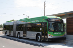 IndyGo Rapid Bus pulling up to a station.