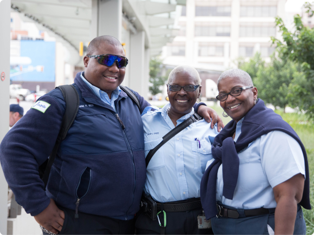 three indygo bus drivers posing for a picture