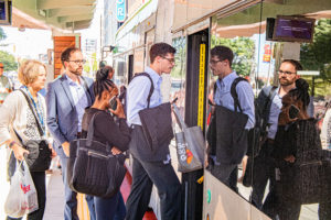 people board a bus