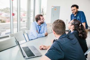 four indygo employees having a meeting