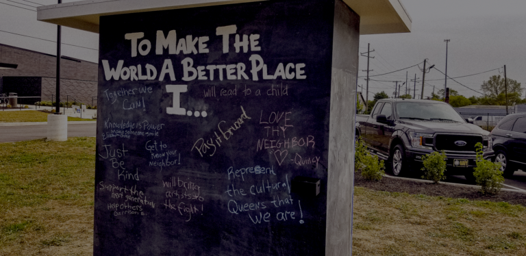 message written on wall about how to make the world a better place
