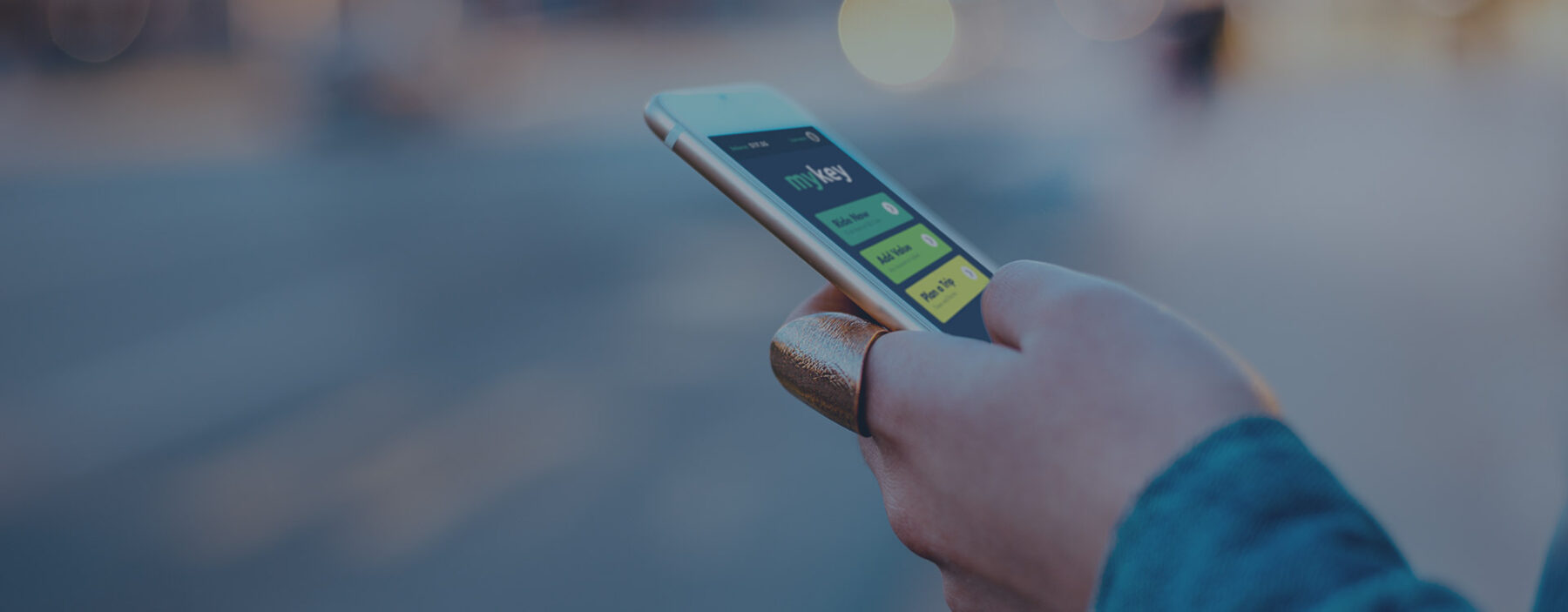 Hand with phone buying bus passes