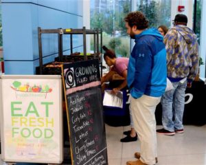 Man looks a food listed on a chalkboard