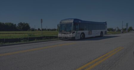 Photo of IndyGo bus stopped at a bus stop.
