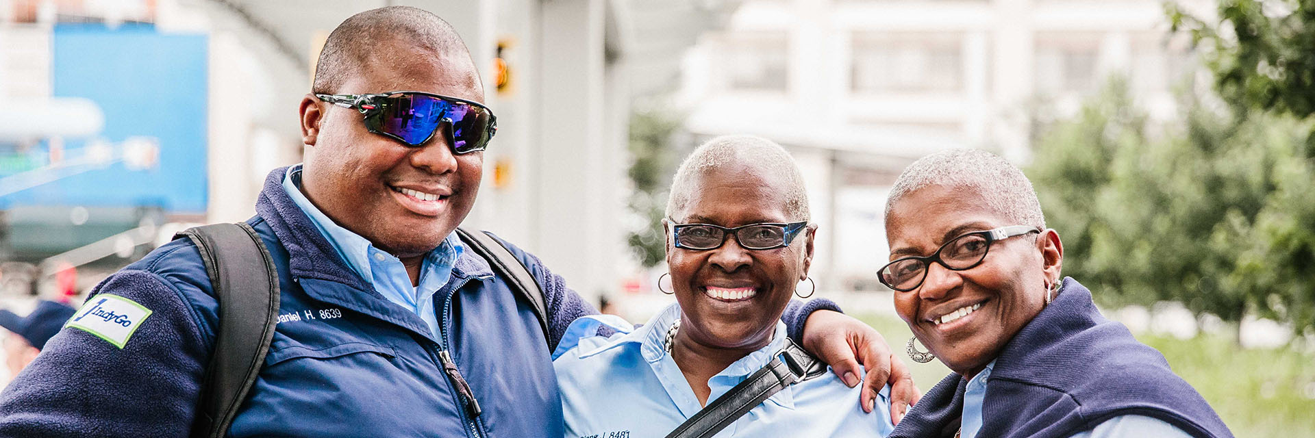 three IndyGo employees smiling