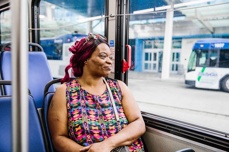 African American woman riding bus