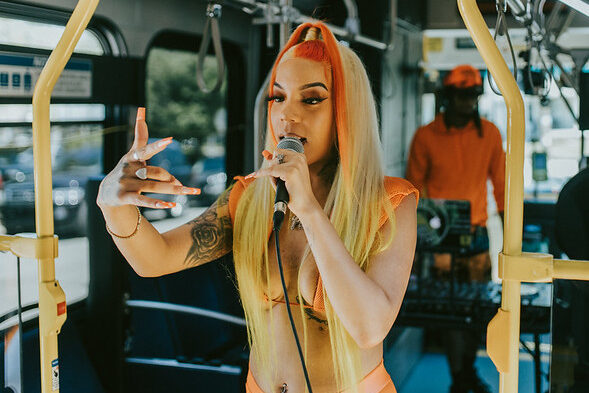 Woman singing on bus