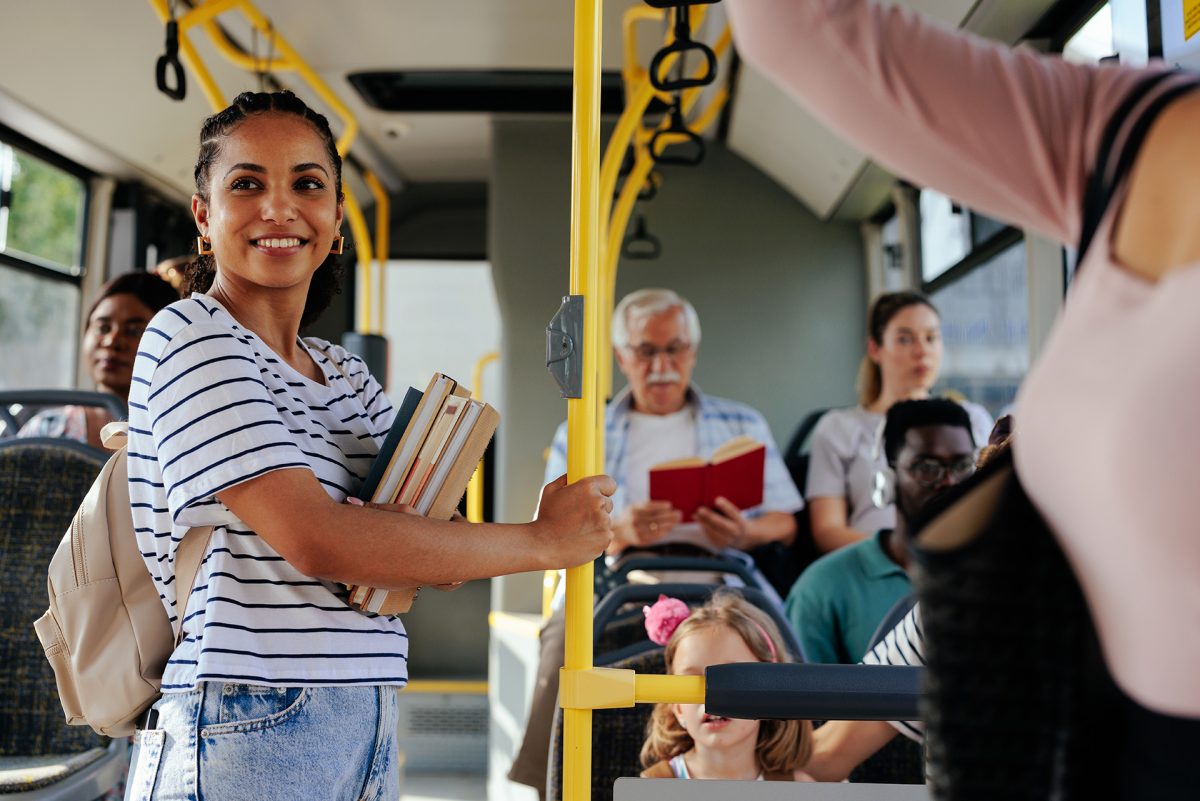 High School Student Riding a City Bus